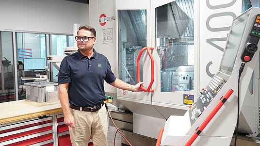 CNC Machinist Brandon Webster programs machining cycle on Smith & Co.‘s C 400 5-axis machine.