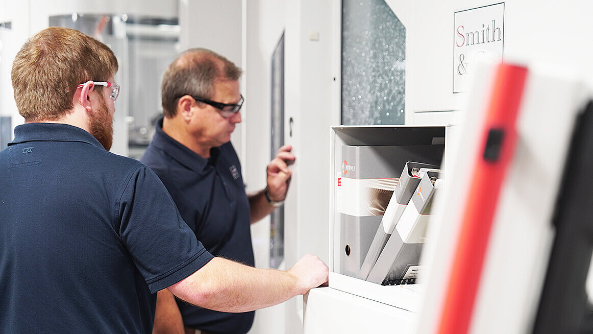 Mechanical Engineer, Jake Smith and Chief Operating Officer Dell Smith inspect work on the HERMLE C 400.