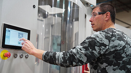 Detroit Gun Works President, Arnot Heller, operates the HERMLE HS flex for firearms manufacturing operations.