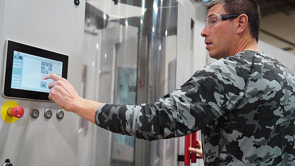 Detroit Gun Works President, Arnot Heller, operates the HERMLE HS flex for firearms manufacturing operations.